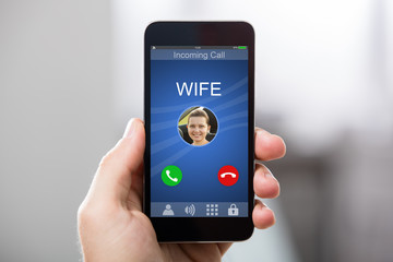 Hand Holding Cell Phone With Blank Screen