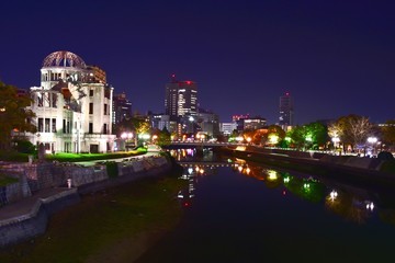 Fototapeta na wymiar Scenery of Hiroshima City and the Atomic Bomb Dome Reflecting the River at Night