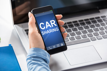 Woman Using Car Sharing Service