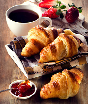 Fresh croissants with coffee cup for a breakfast