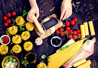 Woman hands preparing pasta