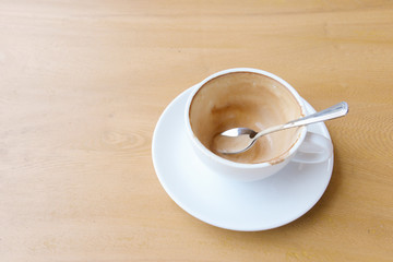 Empty coffee cup after drink on wood table