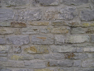 Pattern gray color of modern style. Antique natural stonewall. Stone wall surface with cement. Stones or blocks