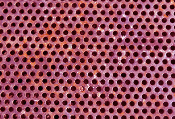 Pink color perforated metal floor pattern.