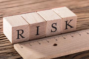 Risk Concept With Wooden Ruler