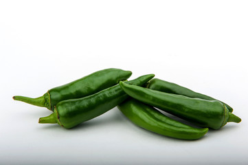 green hot pepper on a white background
