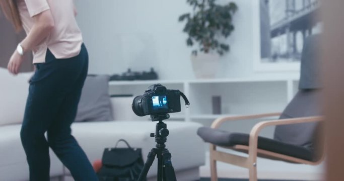 RL DOLLY Young attractive Caucasian girl shooting a beauty fashion video blog at home. 4K UHD RAW edited footage