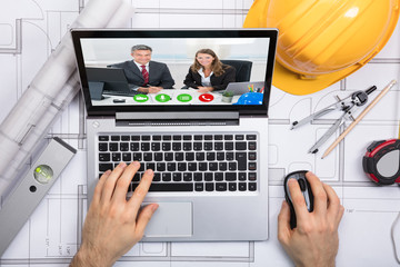 Architect Chatting With Her Colleague On Video Conference