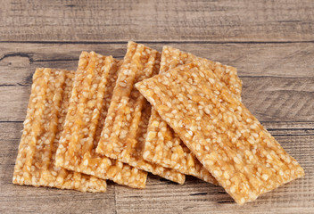 Sesame seed cookies on wooden plank