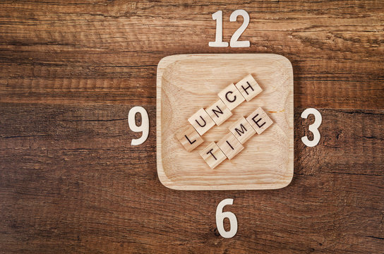 Lunch time wooden alphabet with number of clock.