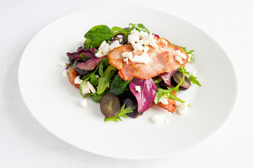 brisket pork on arugula, mangold, and spinach leafs salad with black grapes, bryndza, and marinade dressing 