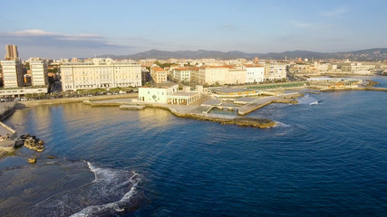 Fototapeta premium Beautiful sunset aerial view of Leghorn coast along Mascagni Terrace, Italy