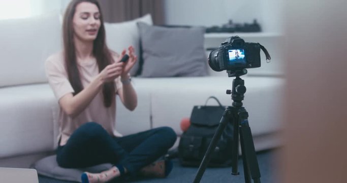 RL DOLLY Young attractive Caucasian girl shooting a beauty fashion video blog at home. 4K UHD RAW edited footage