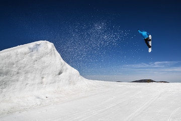 Snowboarder Launching off Jump