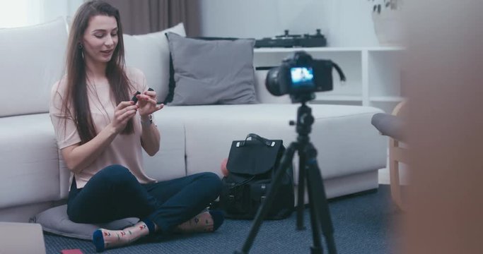 RL DOLLY Young attractive Caucasian girl shooting a beauty fashion video blog at home. 4K UHD RAW edited footage
