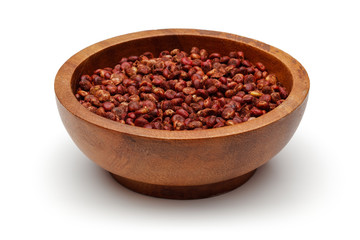 Sumac berries in wooden bowl