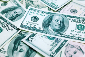 One hundred dollars bills background