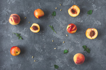 Fototapeta na wymiar Peaches. Fresh peaches on dark background. Flat lay, top view