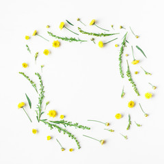 Flowers composition. Frame made of yellow flowers on white background. Flat lay, top view