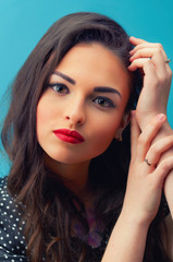 Close-up portrait of young girl in make-up