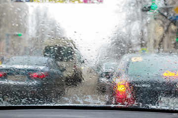 Defocused traffic view from windscreen in rain