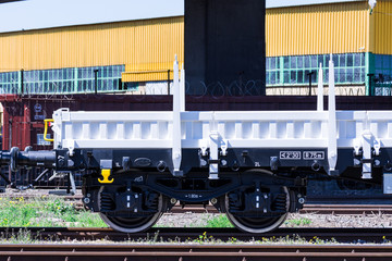 Burgas, Bulgaria - March 20, 2017 - Freight cargo train Wheels - 4axled flat wagon white Type:Rens...