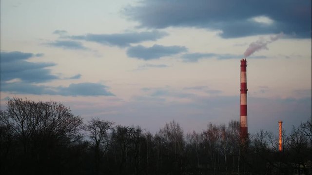 Sunrise Time Lapse Sky and moving clouds Power Plant pipe with smoke Latvia 4K