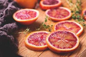 Citrus fruit background with sliced red bloody oranges