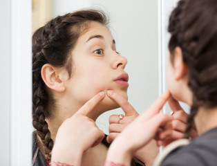 Girl cleaning pores