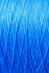 reel blue silk thread. textile concept. abstract background