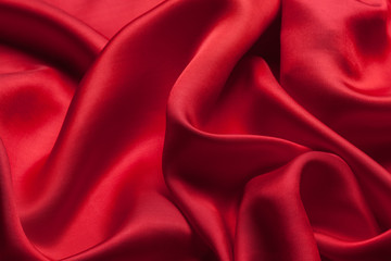 Fototapeta premium Red cloth waves background texture