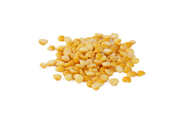 Dry yellow split peas isolated on white.