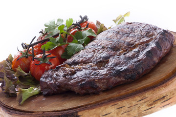 Grilled steak with roasted tomatoes