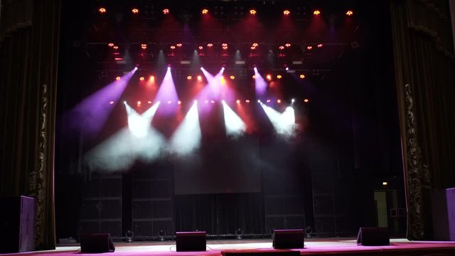 Stage Lighting Background. Stage lights. Several projectors in the dark. 4k