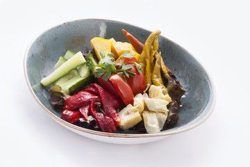 pickled and fresh vegetables on the plate