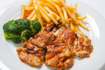 fried chicken with fries on white plate