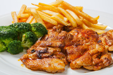 fried chicken with fries on white plate