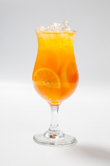 Drink with lemon, orange and ice on white background