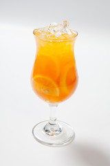 Drink with lemon, orange and ice on white background