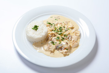stewed chicken with white rice and mashroom sauce