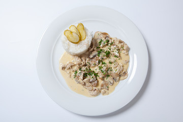 stewed chicken with white rice and mashroom sauce