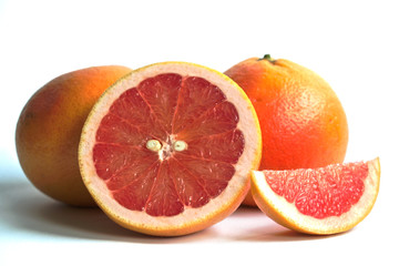 Closeup of red grapefruits on a white background