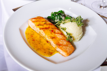 Grilled Salmon Steak with Spinach,Mash potato, souse