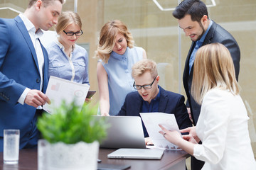 Fototapeta premium The business man is tired of multitasking and complex work, he has a headache