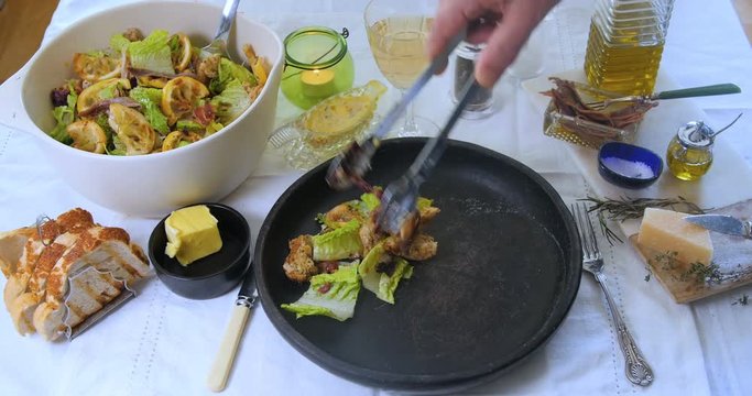 Serving a portion of a delicious Caesar's salad