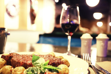 Serving a glass of red wine in a restaurant