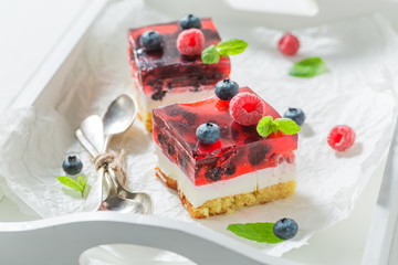 Delicious cheesecake with fresh blueberries and raspberries