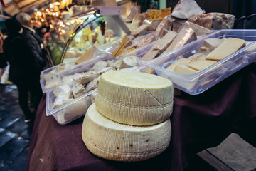 Stall with cheese in La Pescheria market place in Catania, Sicily Island of Italy
