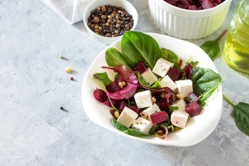Healthy homemade vegetable salad with beets and nuts. The concept of a healthy diet and detox diet. Copy space.