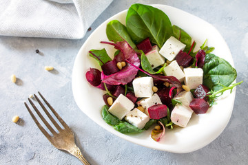 Healthy homemade vegetable salad with beets and nuts. The concept of a healthy diet and detox diet. Copy space.